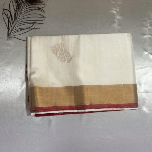 Pure white with rich crimson red pallu